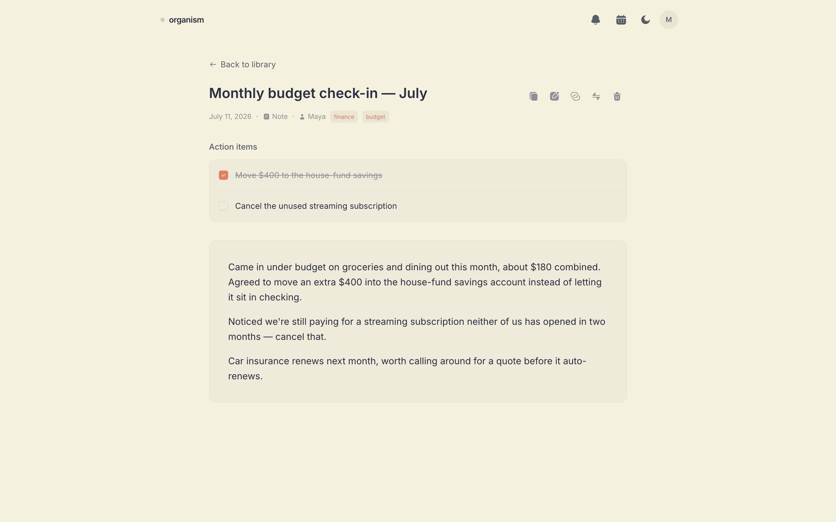 A monthly budget check-in note in Organism with action items for savings and subscriptions